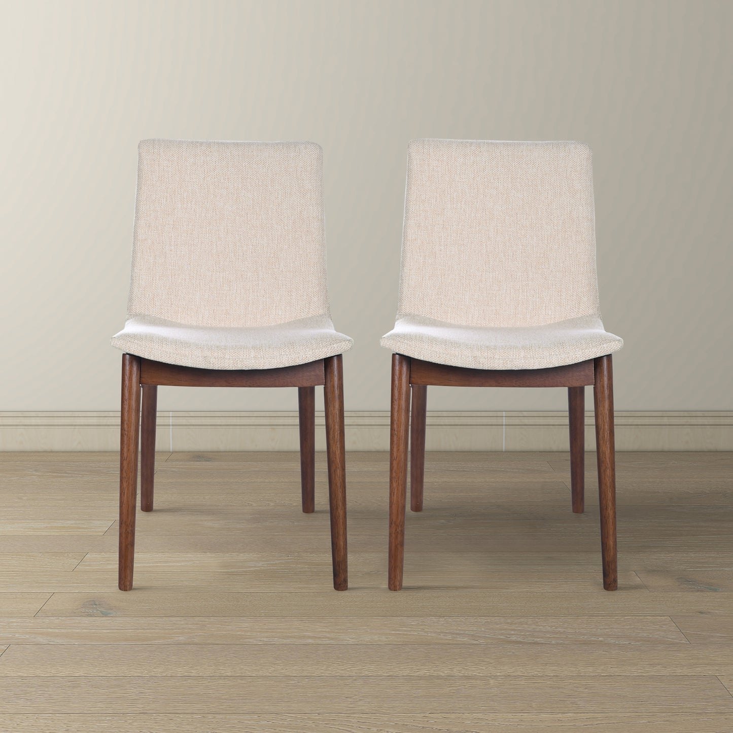Two beige linen upholstered chairs with dark wood legs