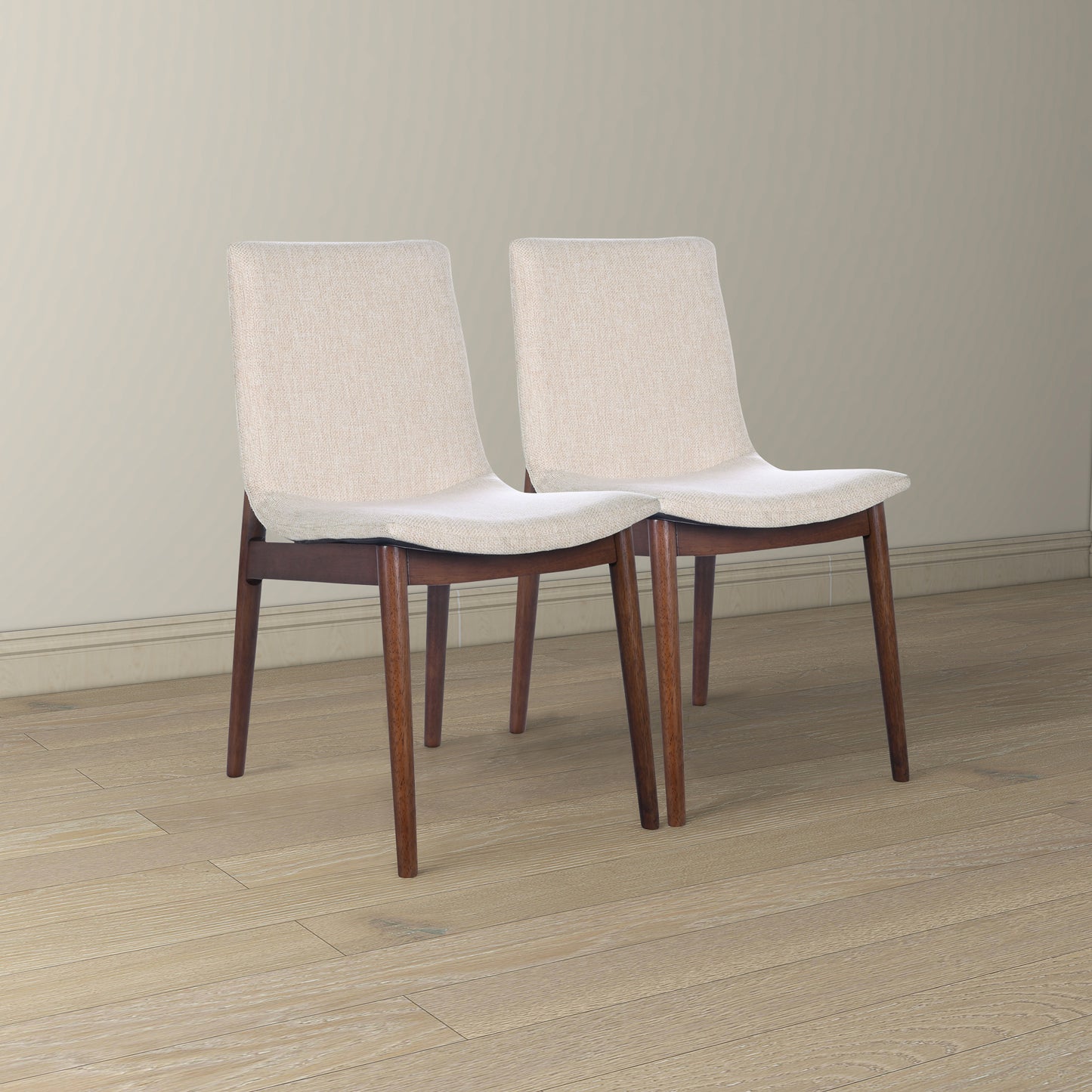 Beige upholstered dining chairs with dark wood legs