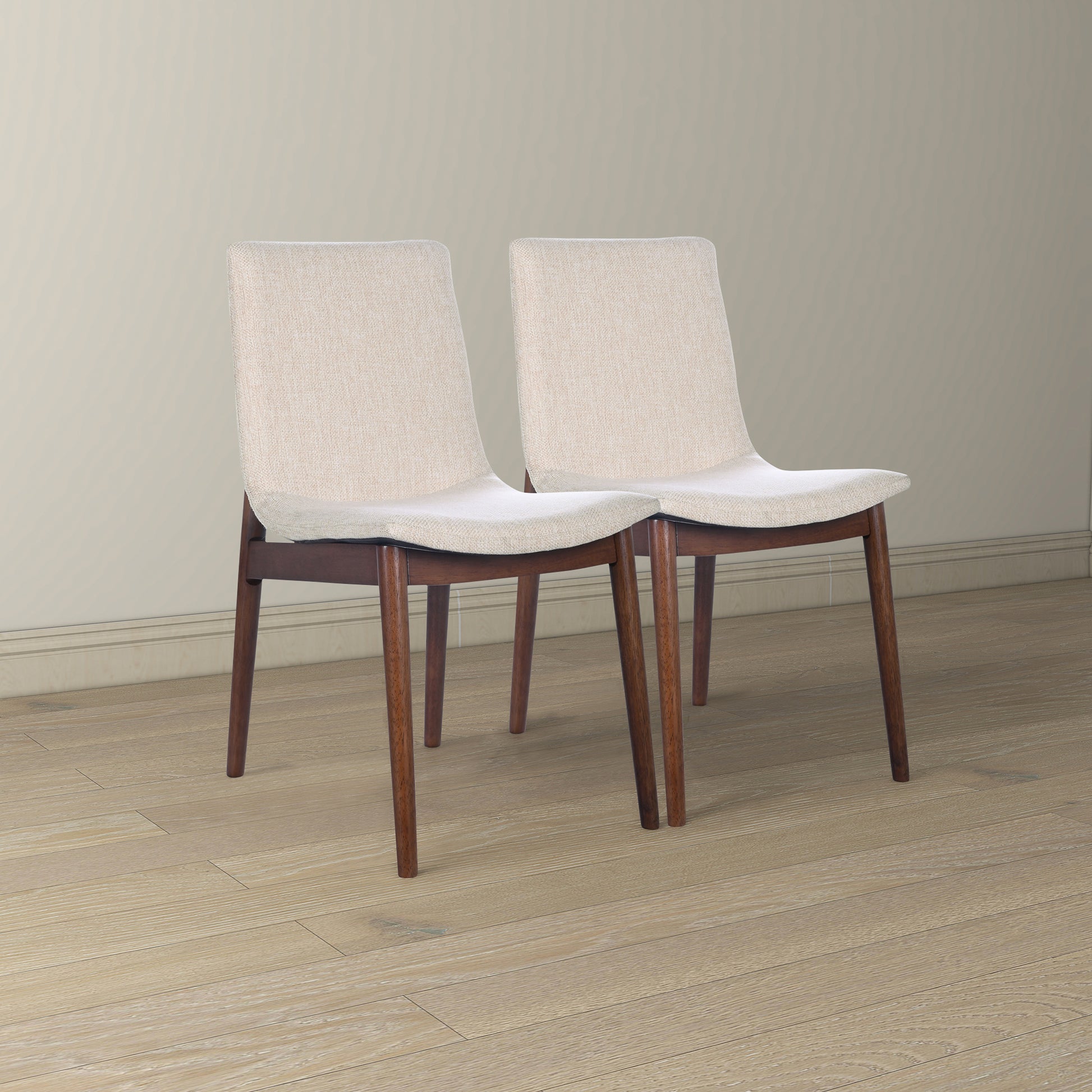Beige upholstered dining chairs with dark wood legs