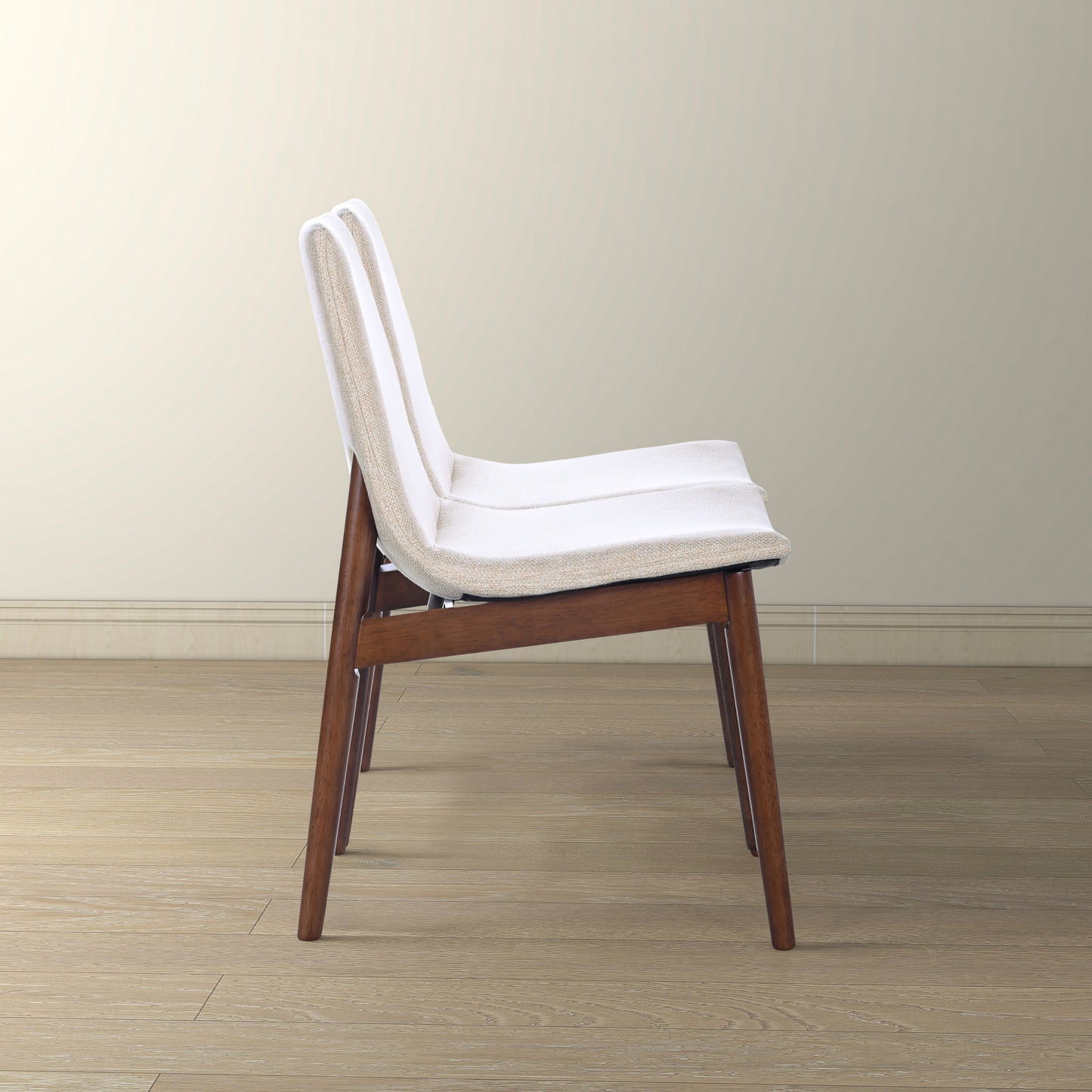 White upholstered dining chair with dark wood legs