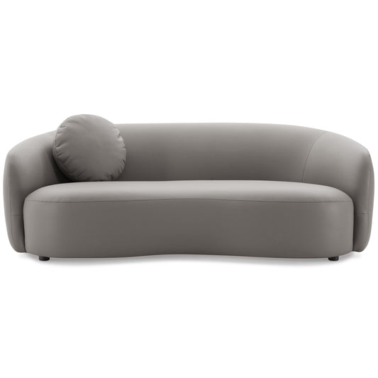 Modern grey leather couch with a round accent pillow for stylish living rooms