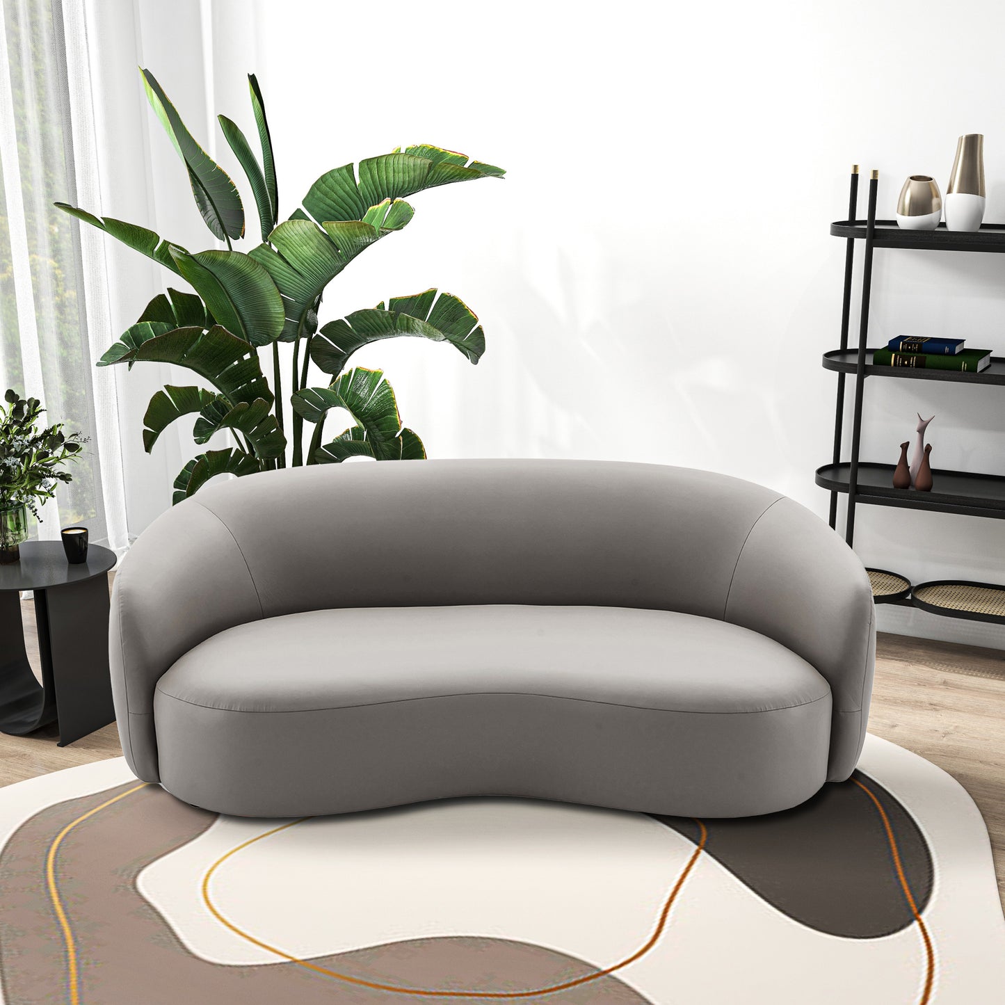 Curved gray velvet sofa with modern design and sleek lines