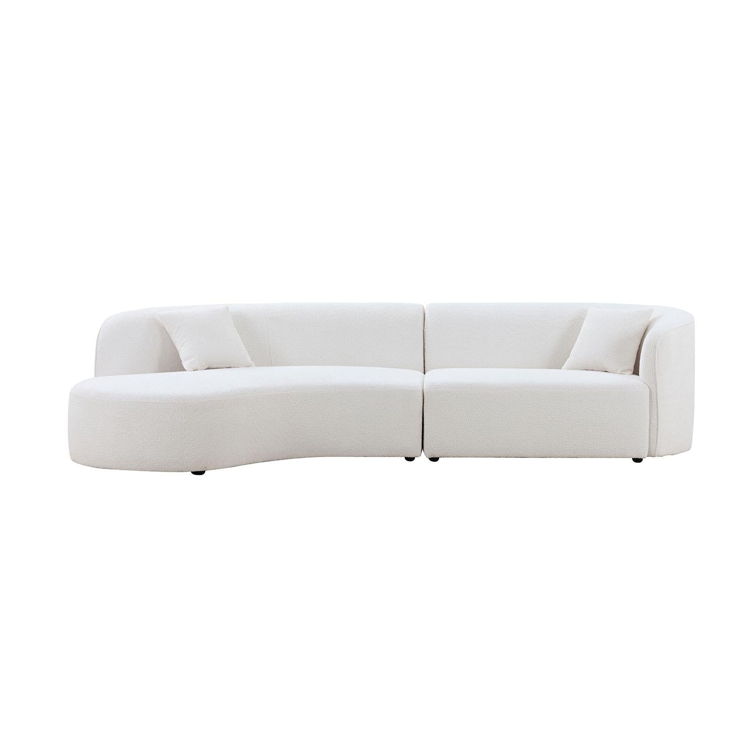 Curved white boucle sofa with plush cushions for a modern living room