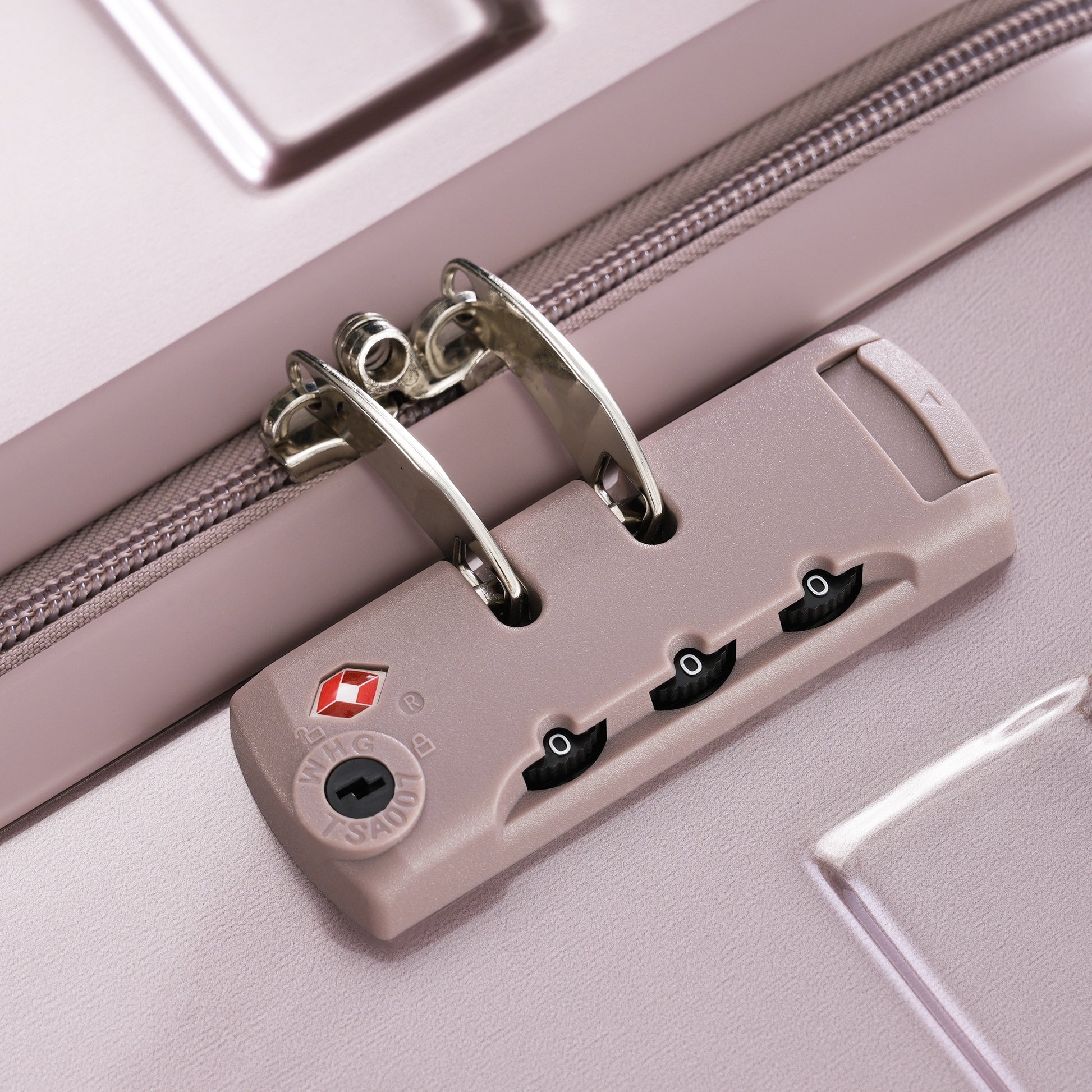 Rose gold suitcase TSA lock detail