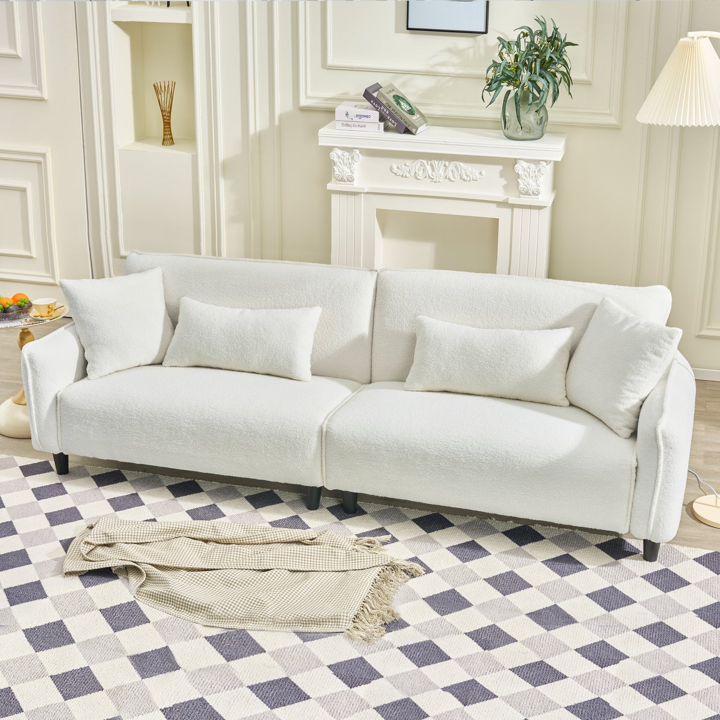 Plush white sofa with textured fabric and lumbar pillows