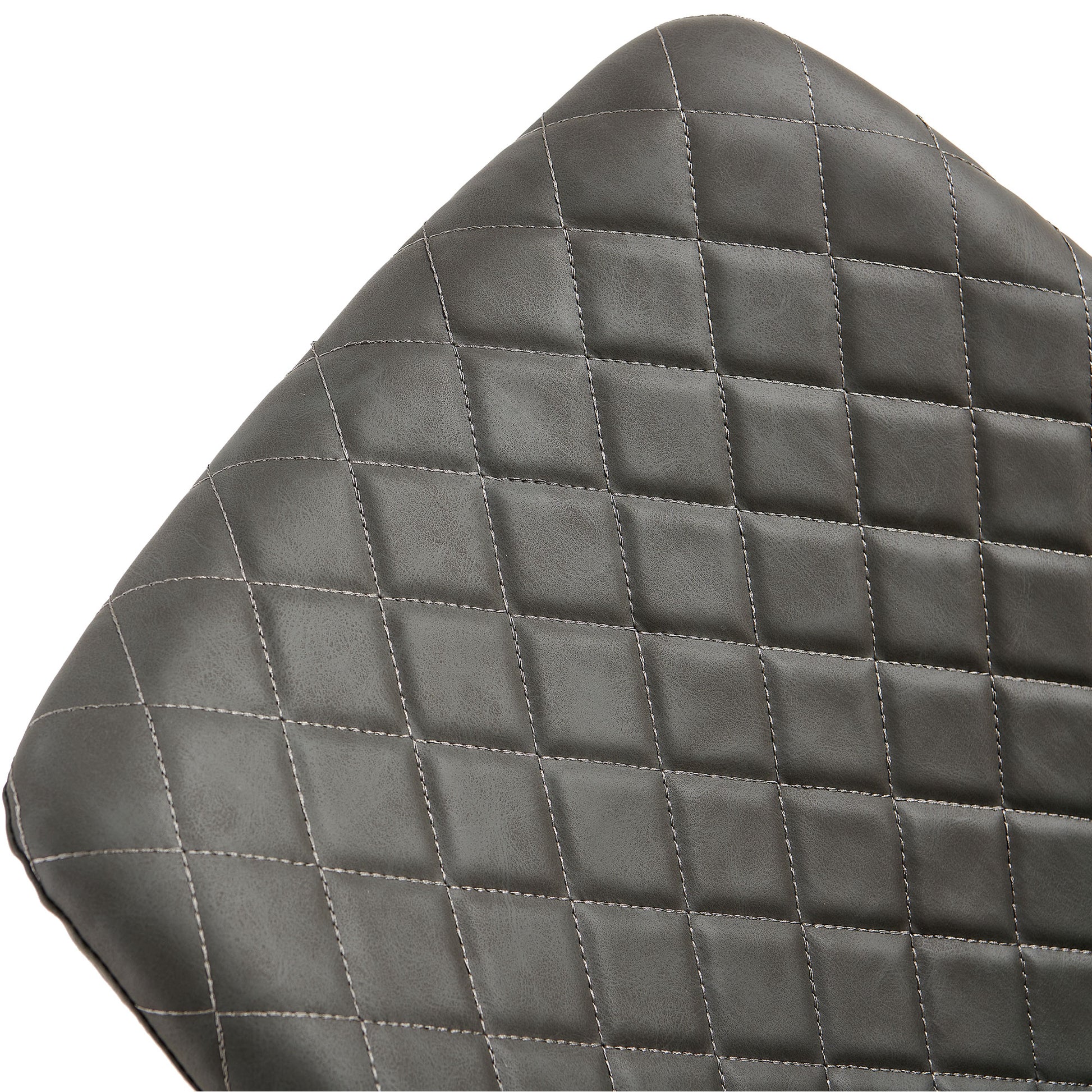Closeup of dark gray faux leather seat cushion with diamond stitching