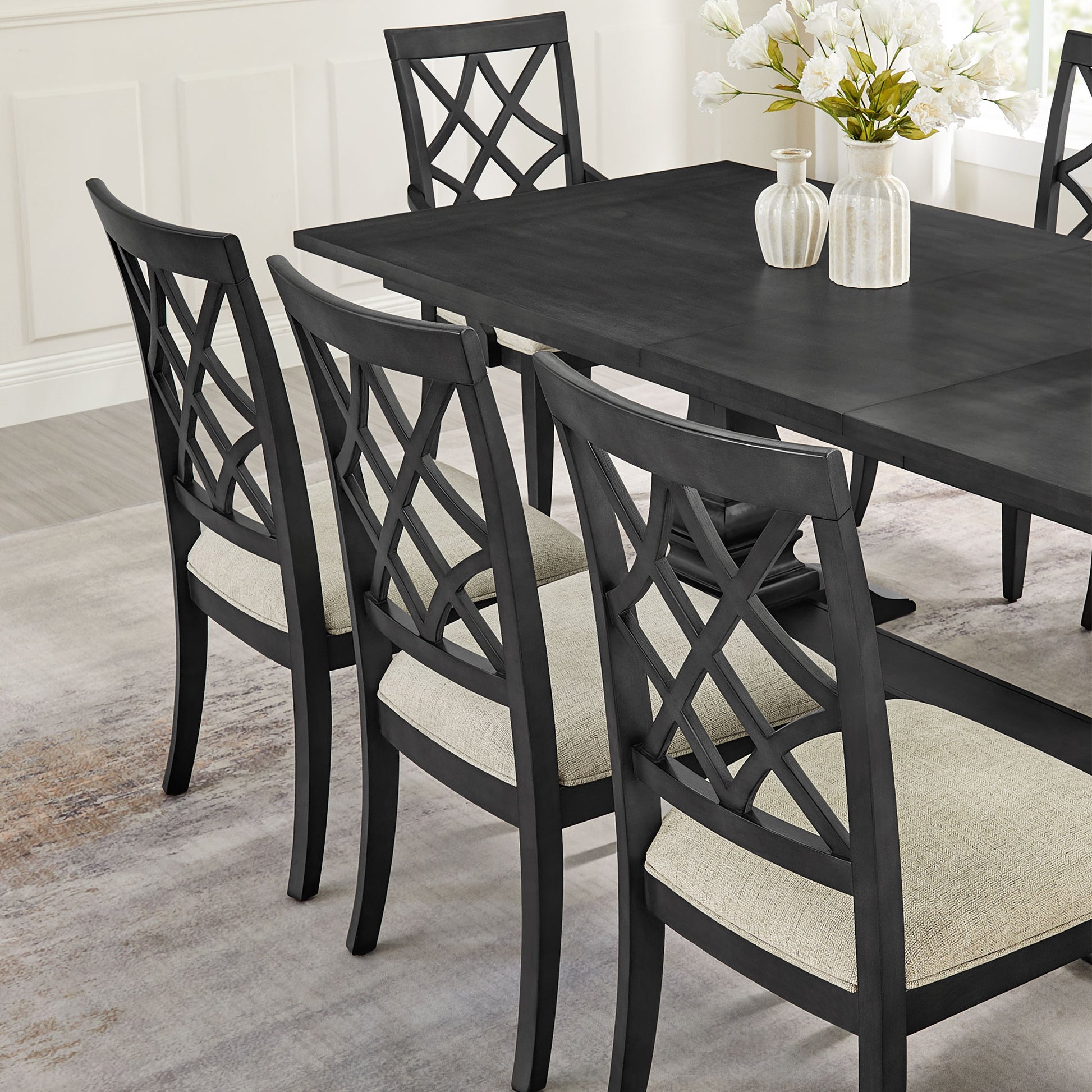 Black wood dining chair with diamond lattice back and upholstered seat