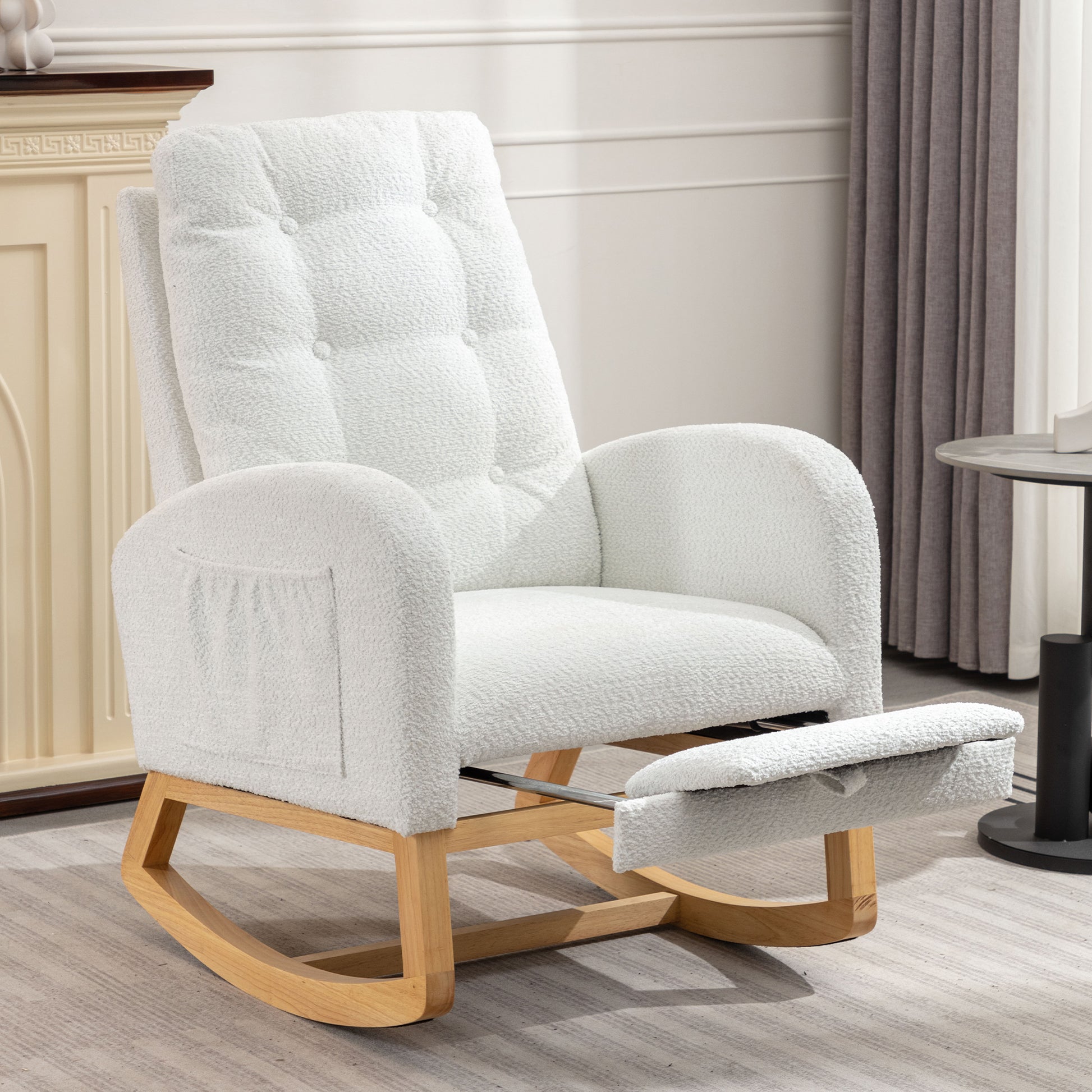 White boucle fabric rocking chair with extended footrest and wooden base