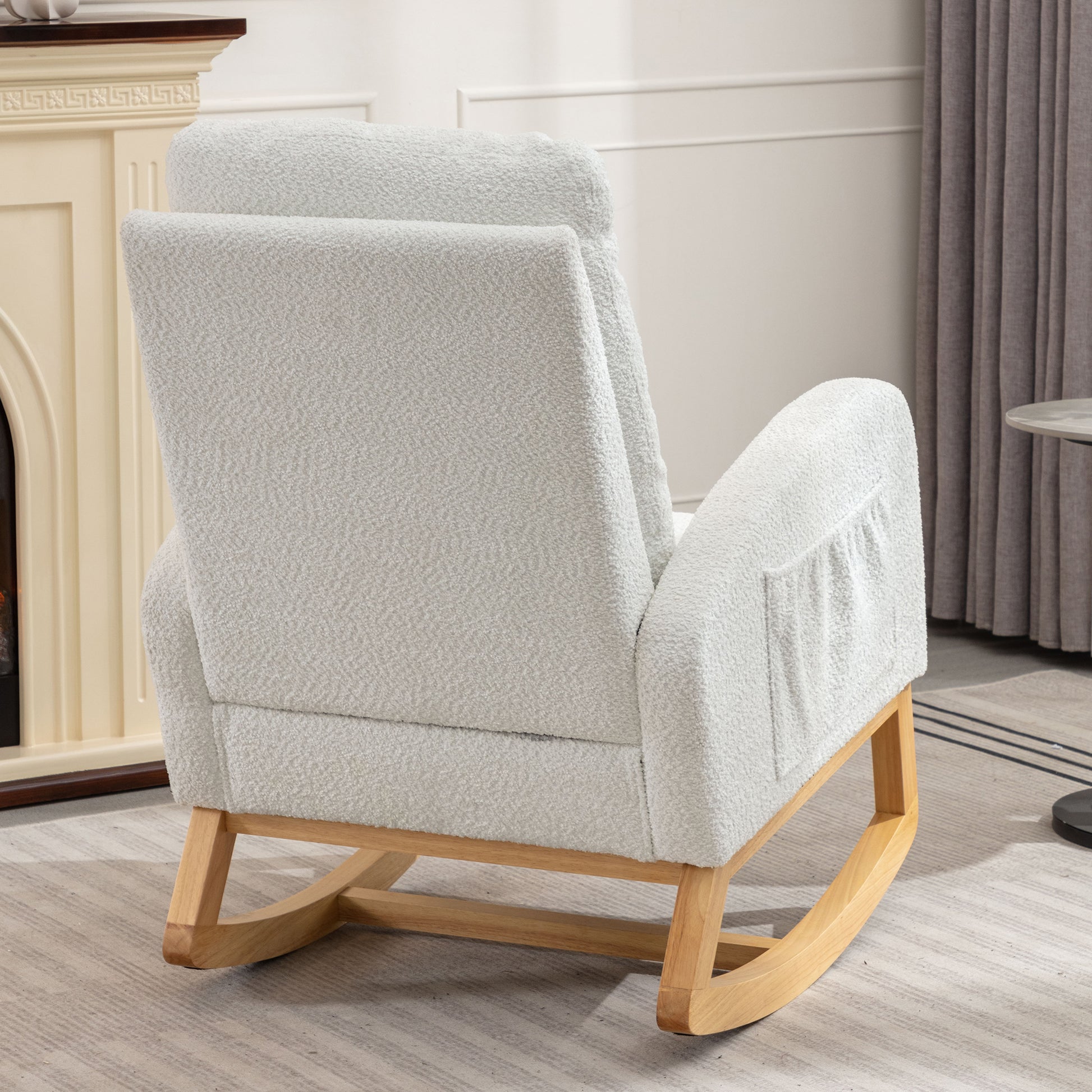 Light grey boucl fabric upholstered rocking chair with wooden base