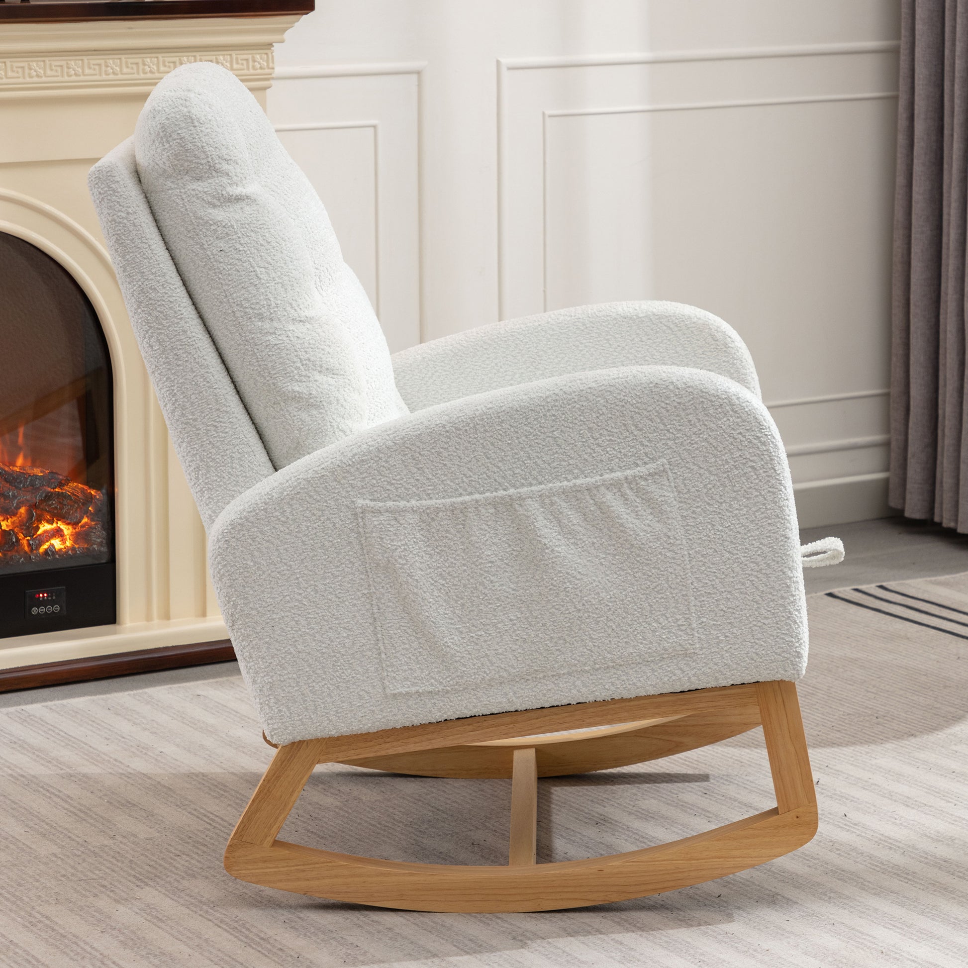 White boucle fabric rocking chair with wooden base and side pocket