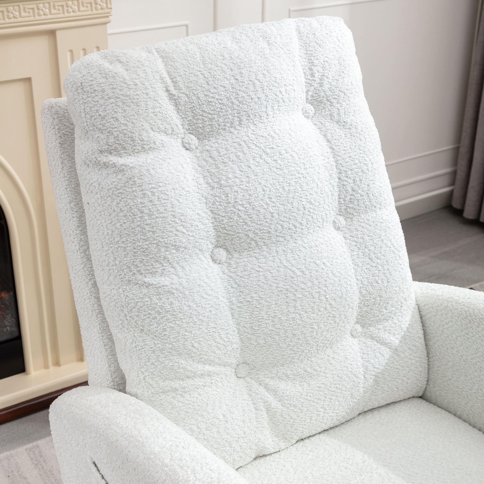 Plush white armchair with tufted backrest