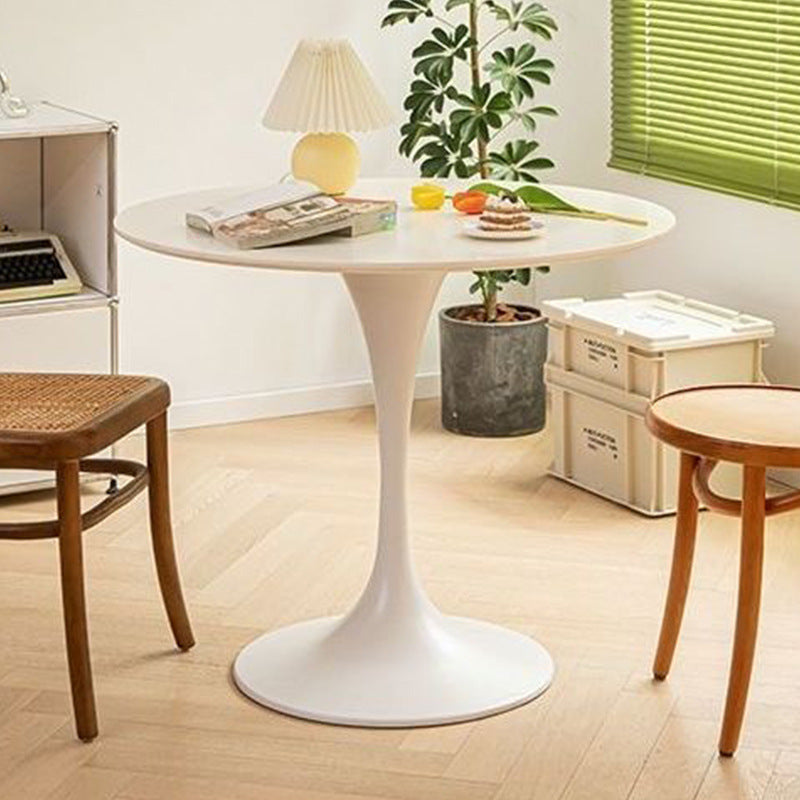 White tulip round dining table with a single pedestal base