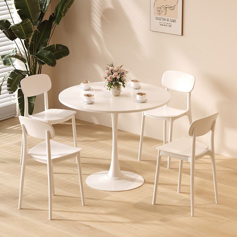 White tulip dining table with four chairs