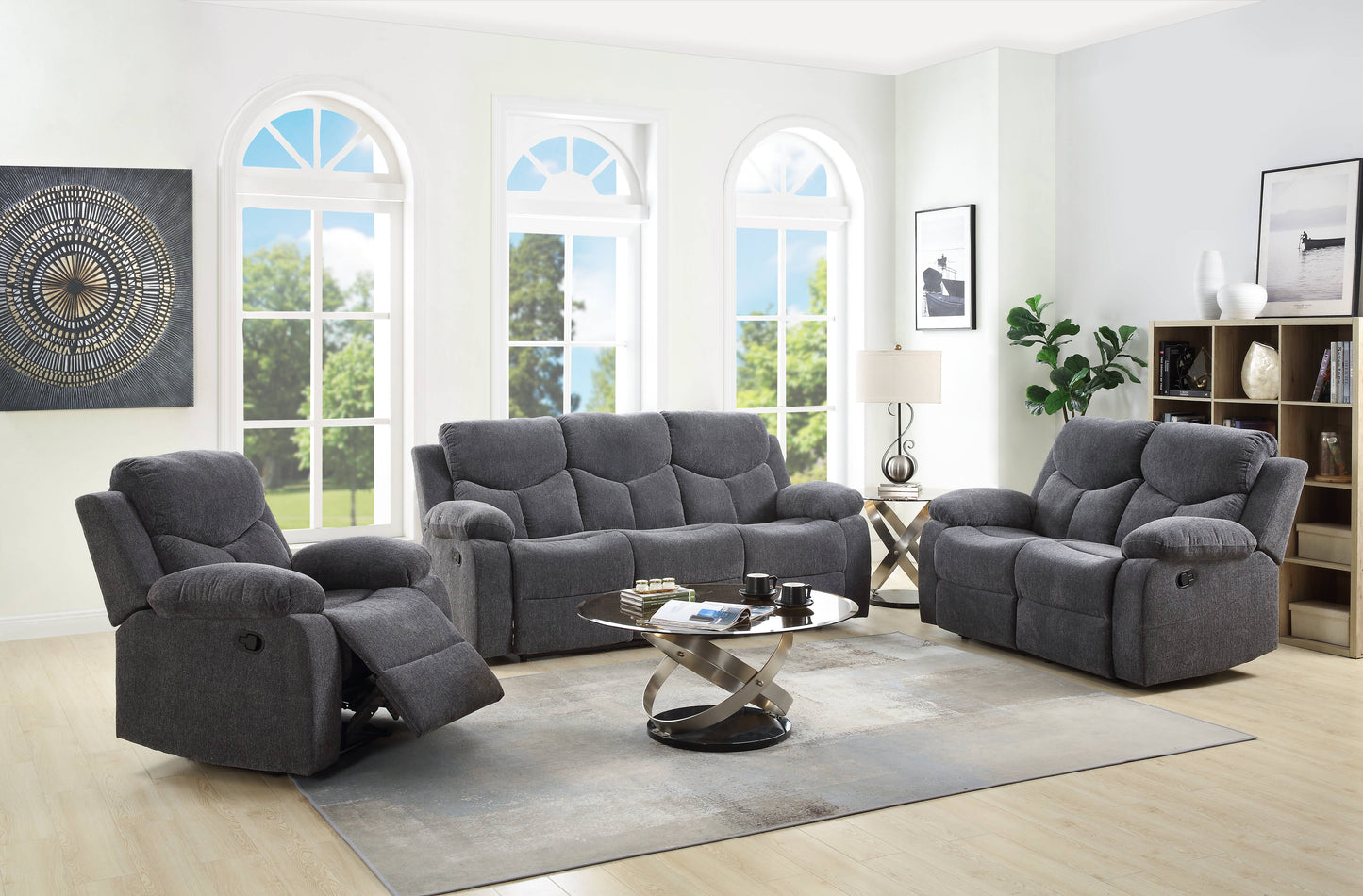 Dark grey fabric reclining sofa with plush cushions and padded arms