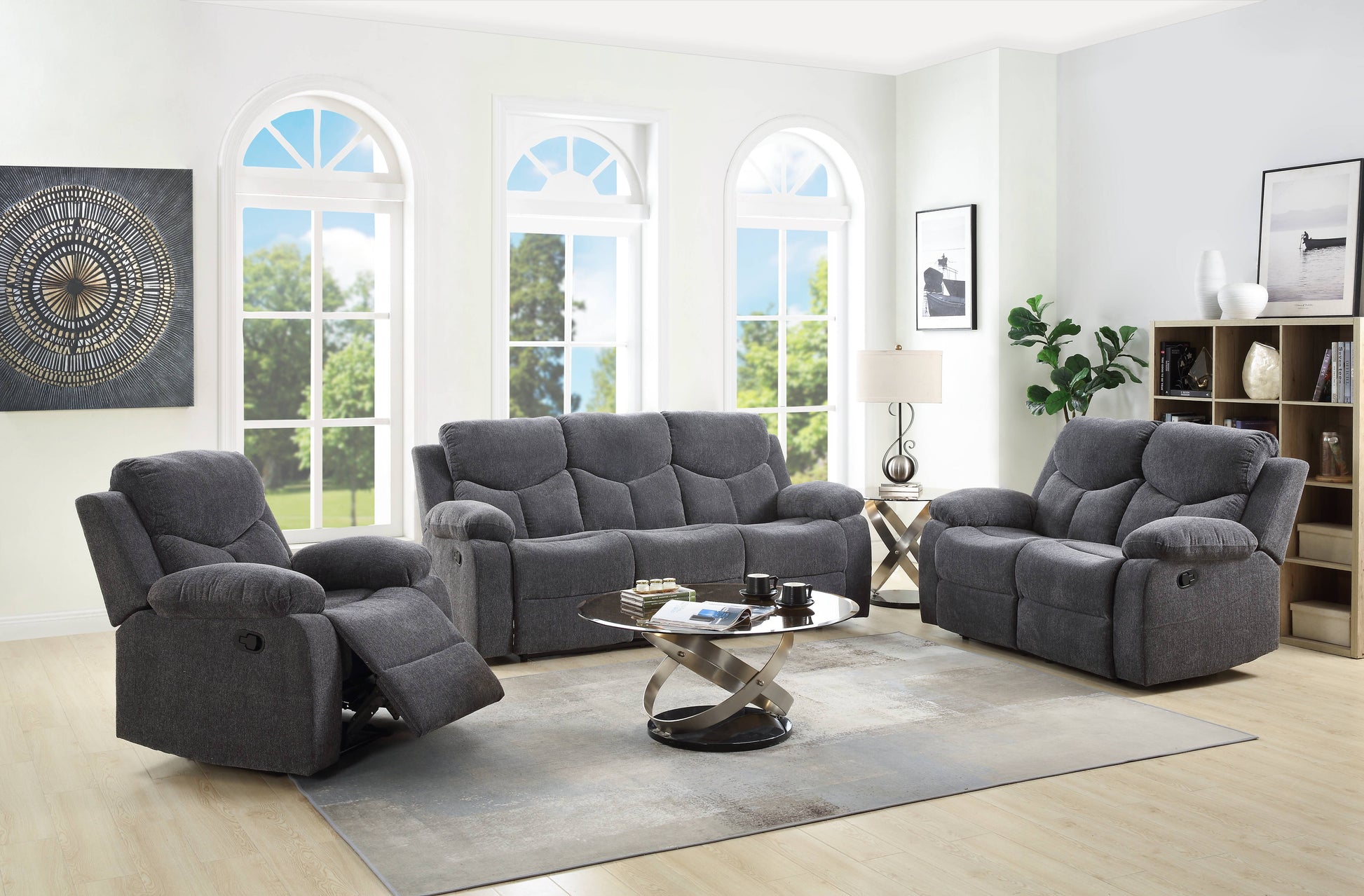 Dark grey fabric reclining sofa with plush cushions and padded arms