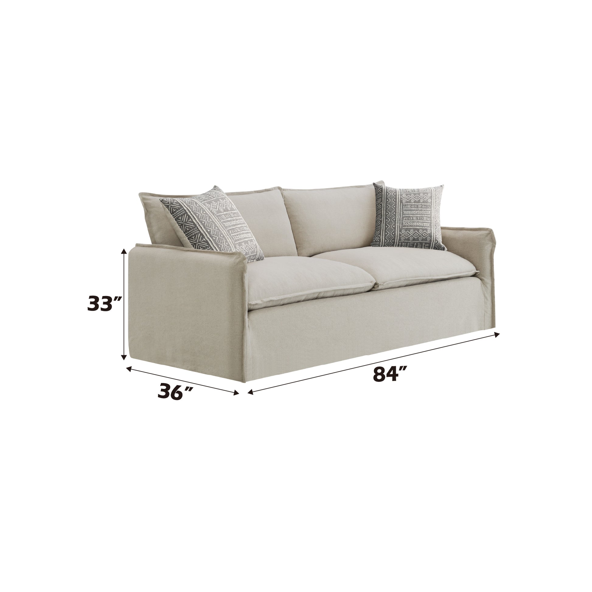 Tan linen slipcovered sofa with two geometric patterned throw pillows