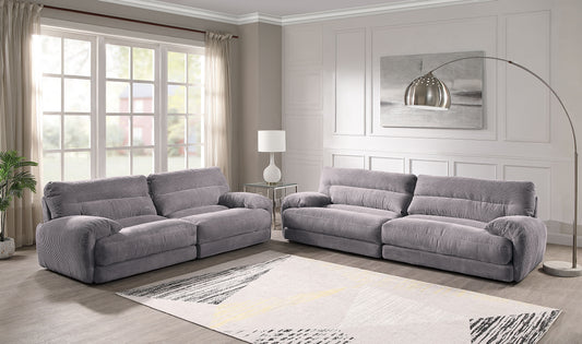 Plush gray corduroy reclining sofa for ultimate comfort