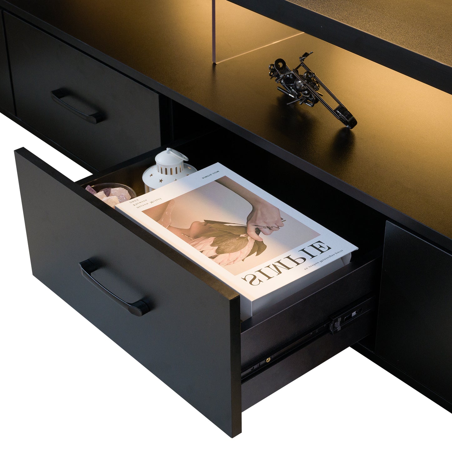 Black modern media console with open drawer and magazine