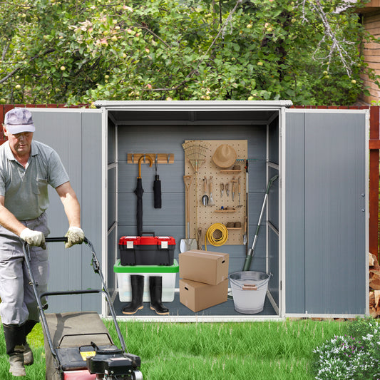 Gray metal garden shed organized with gardening tools and storage bins