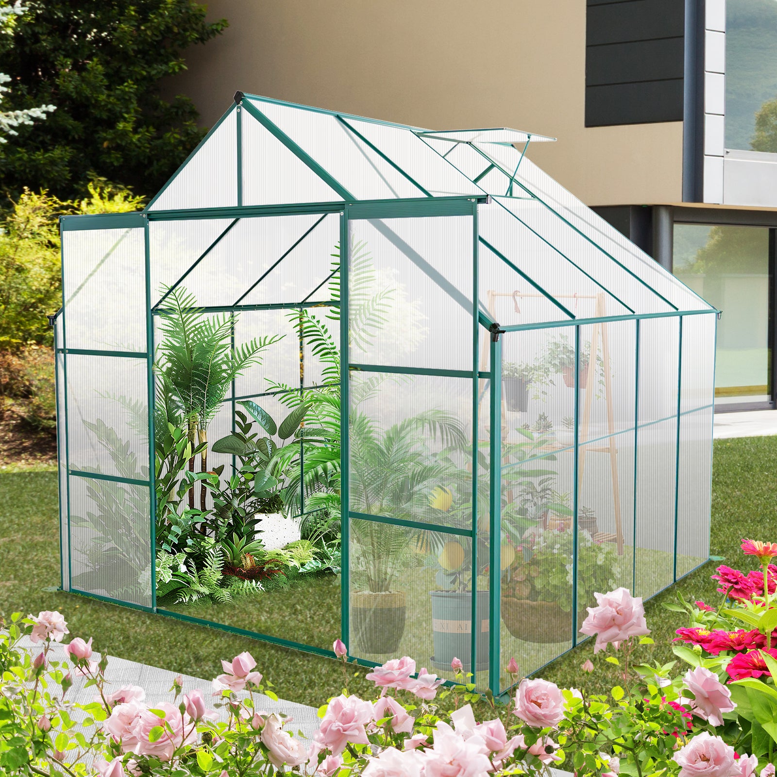 Green metal frame greenhouse with polycarbonate panels