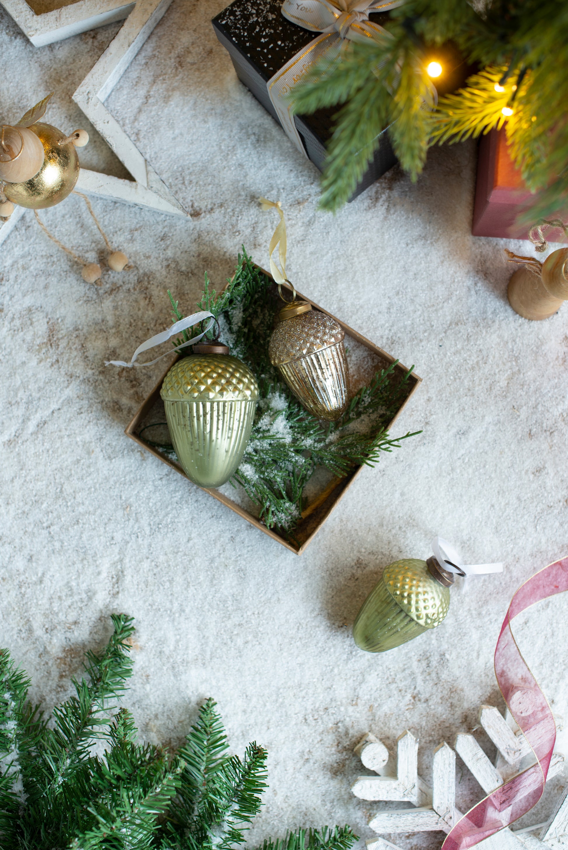 Gold glitter acorn Christmas ornament with white ribbon