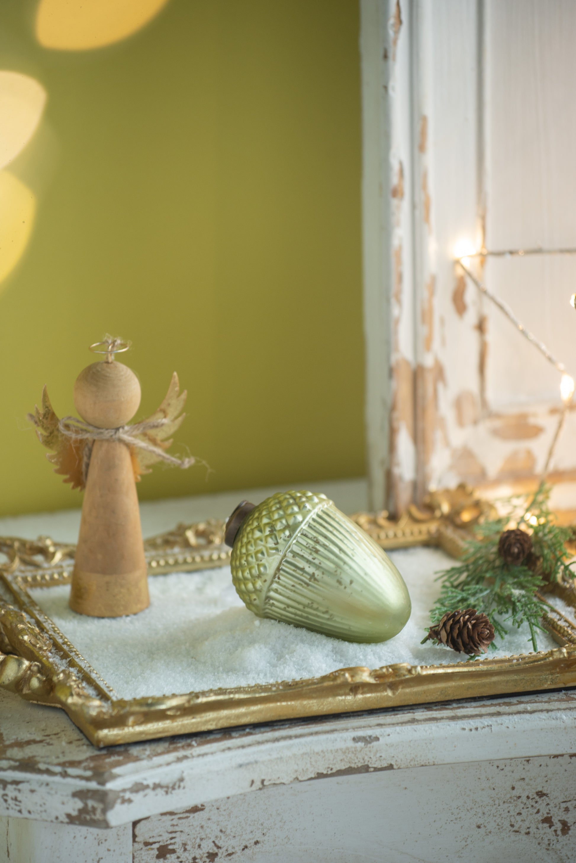 Glass acorn ornament in mint green with ribbed texture