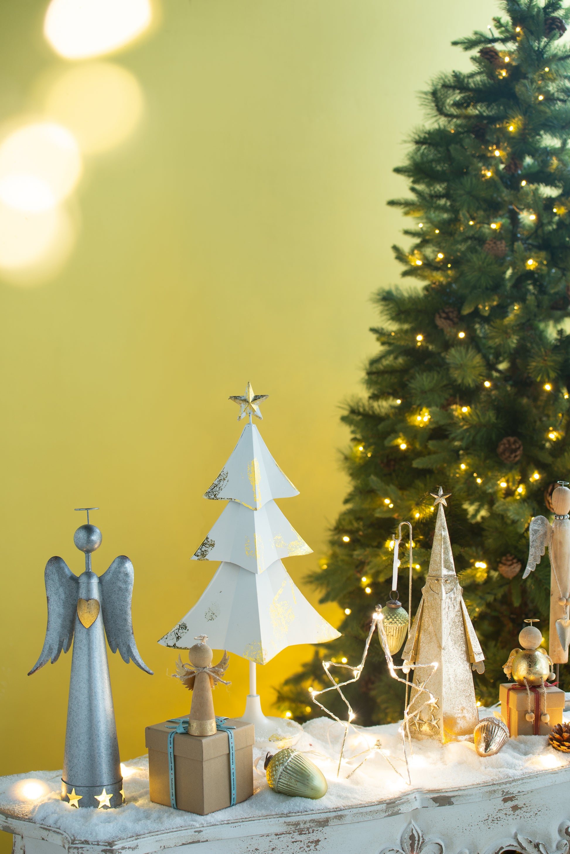 Silver angel figurine with gold heart and illuminated star base Christmas decoration
