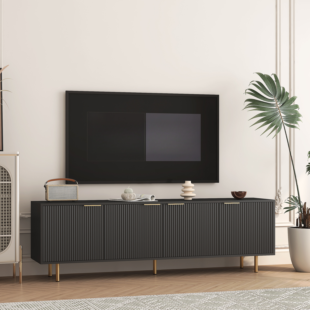 Dark grey ribbed media console with gold legs and brass handles
