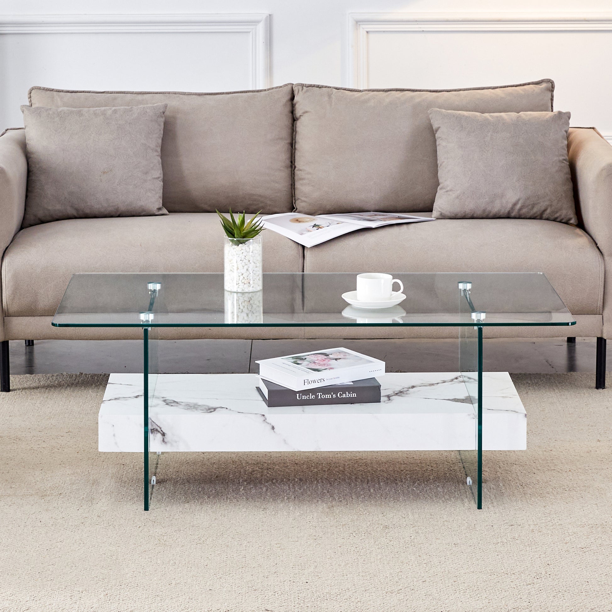 Modern clear glass coffee table with marble base