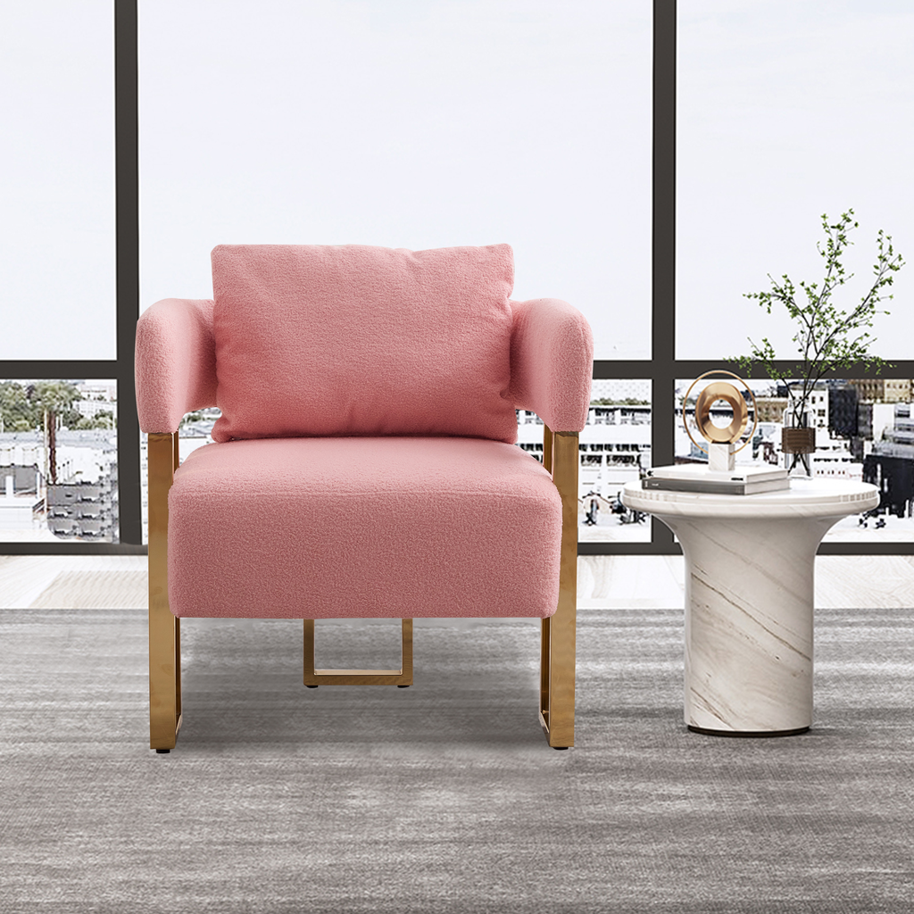 Pink boucle armchair with gold metal legs and plush seat cushion