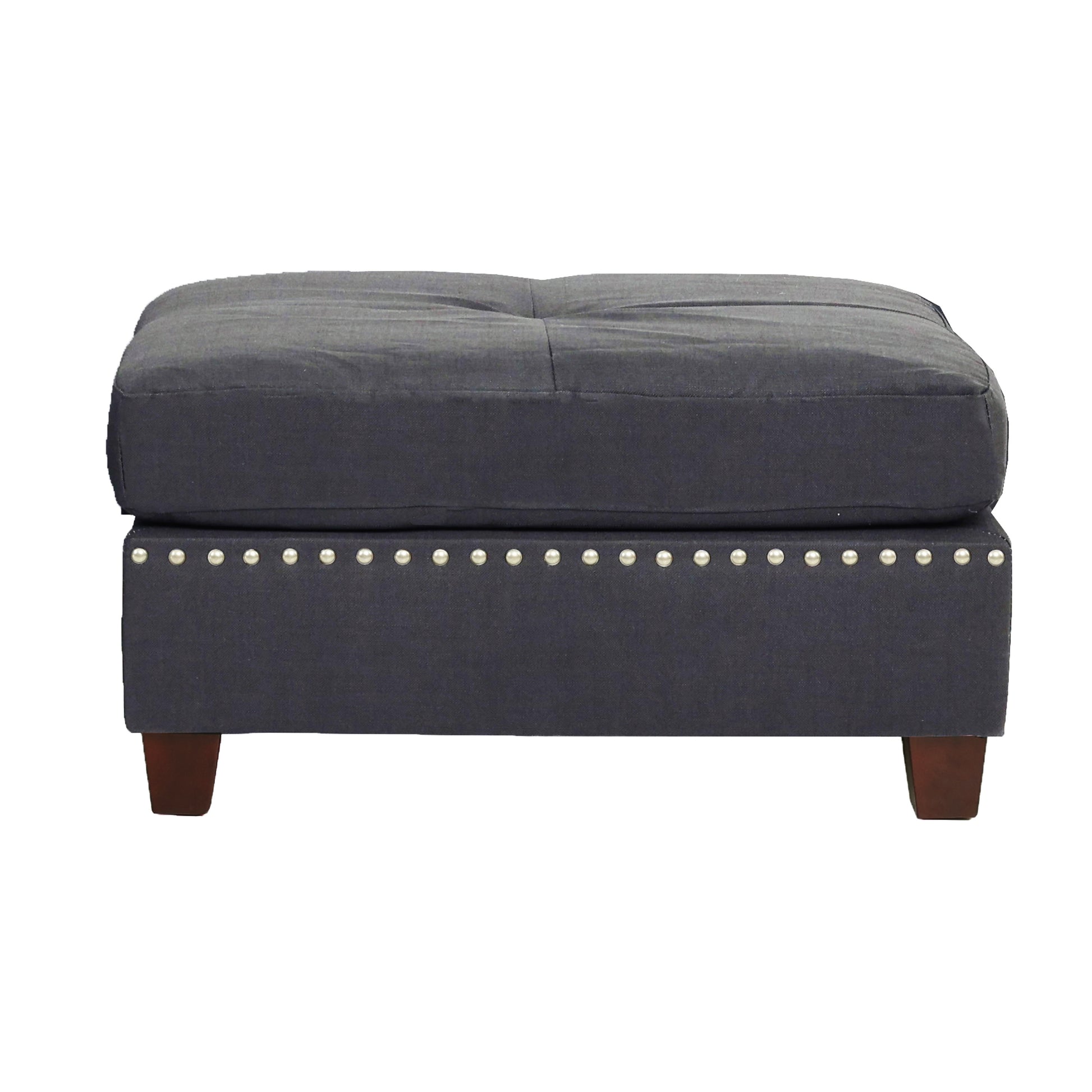 Dark gray upholstered ottoman with button tufting and silver nailhead trim