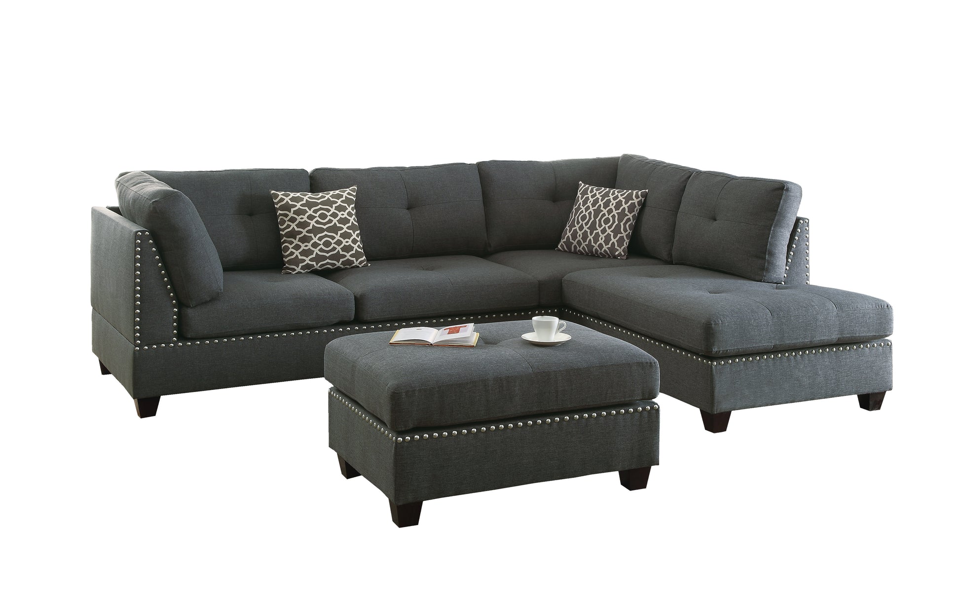 Dark grey linen sectional sofa with studded trim and accent pillows