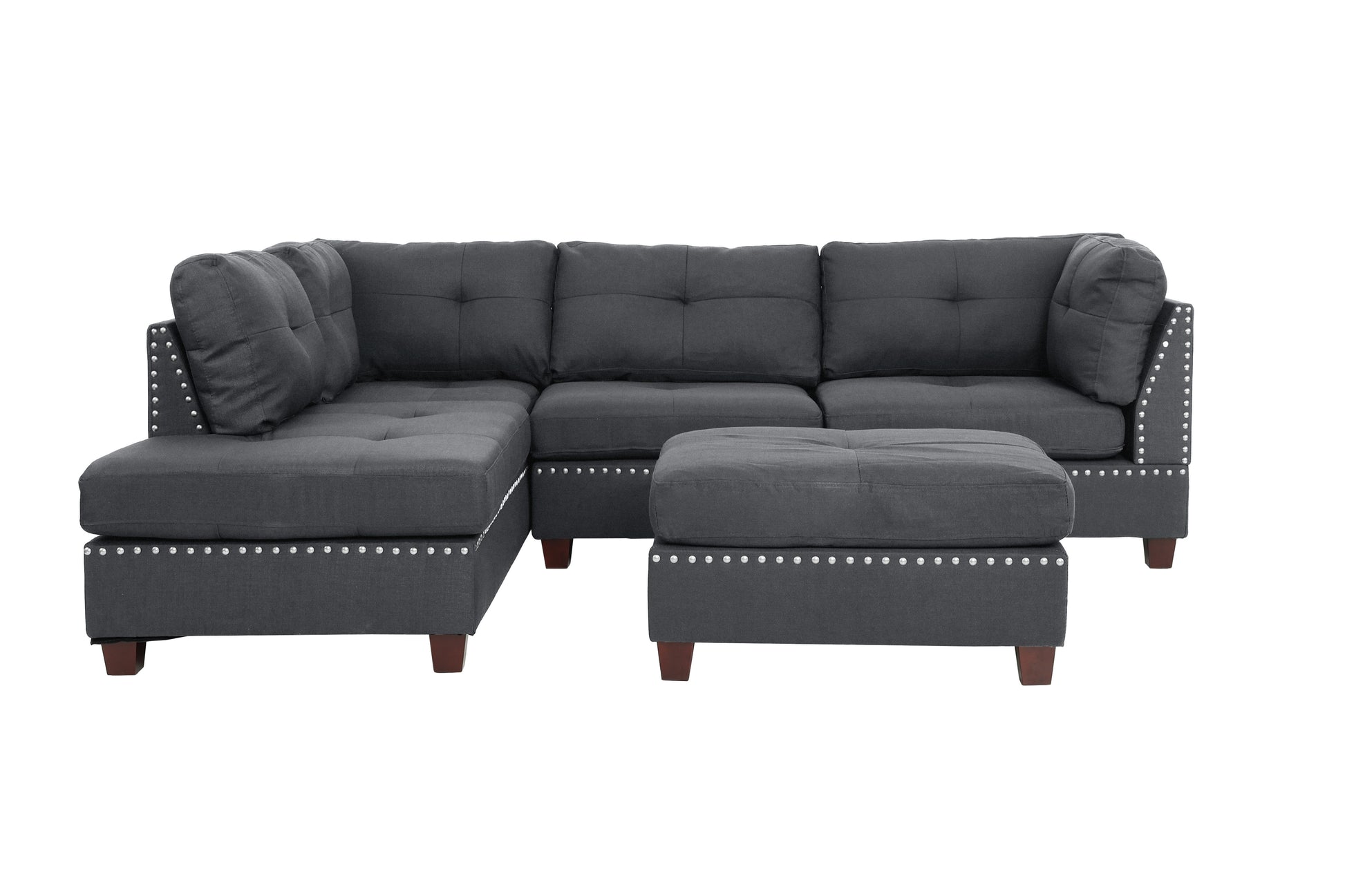 Dark grey fabric sectional sofa with silver nailhead trim and tufted cushions
