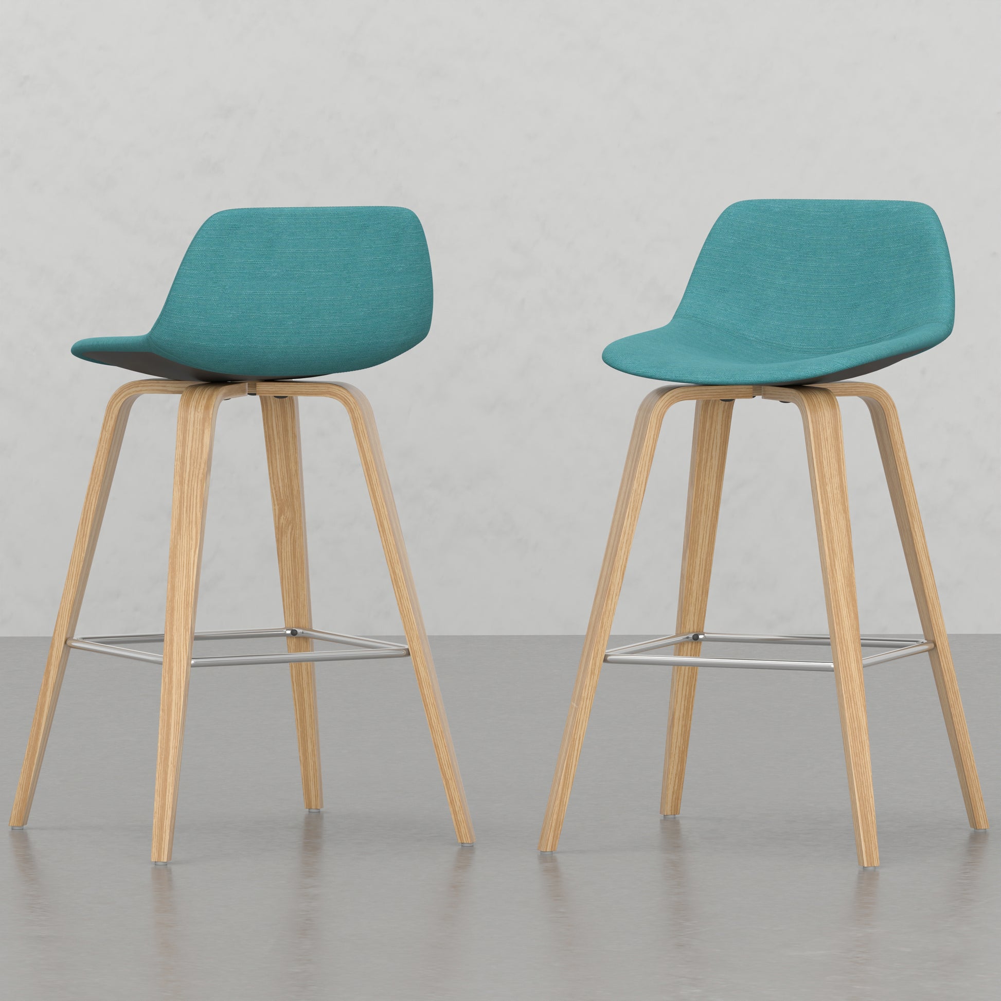Teal fabric counter stool with light wood legs and metal footrest
