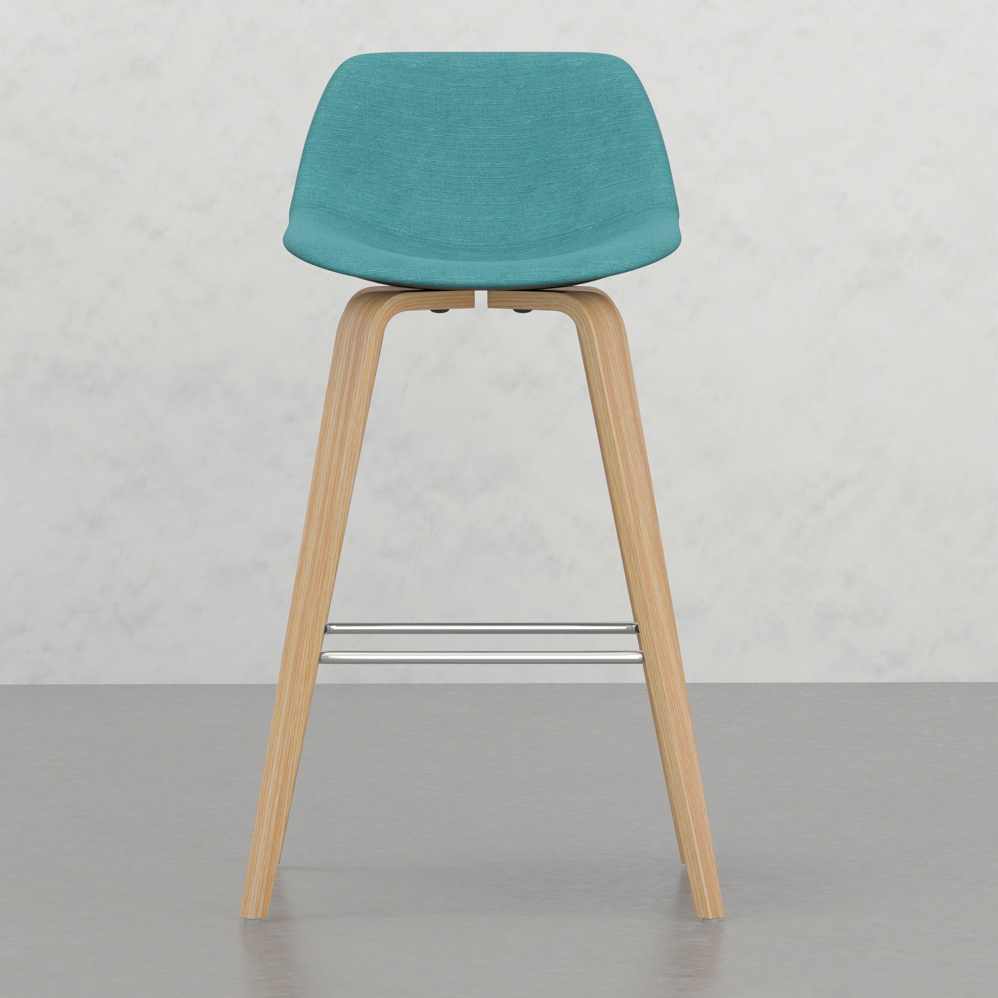 Teal upholstered stool with natural wood legs and chrome footrest