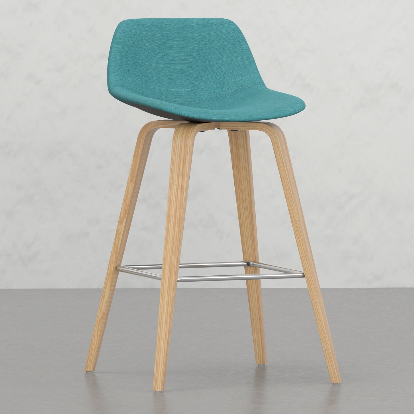 Turquoise upholstered bar stool with natural wood legs and chrome footrest
