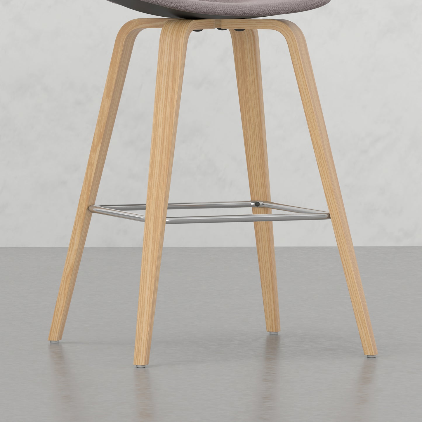 Modern bar stool with natural wood legs and a grey upholstered seat