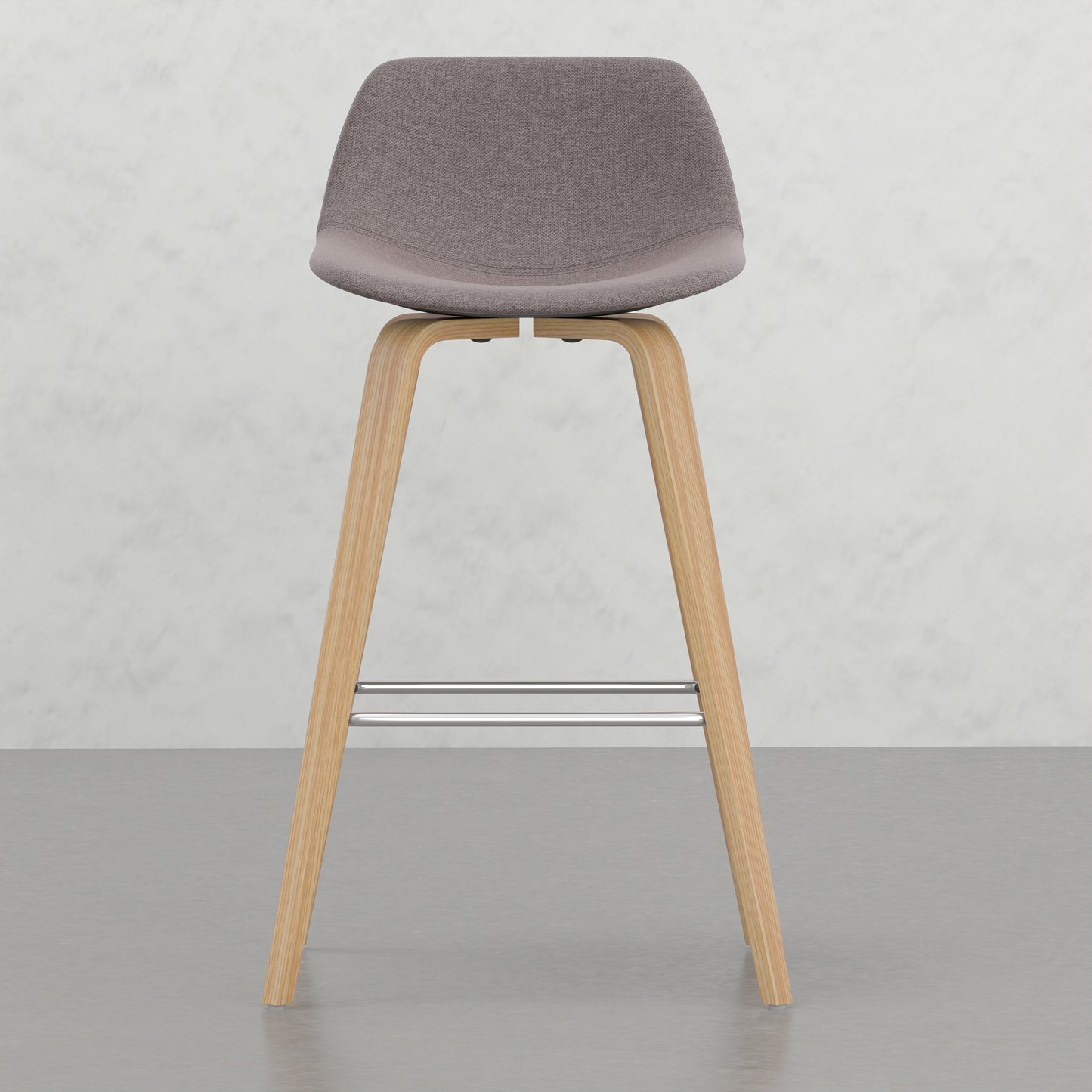 Grey upholstered bar stool with wooden legs and chrome footrest