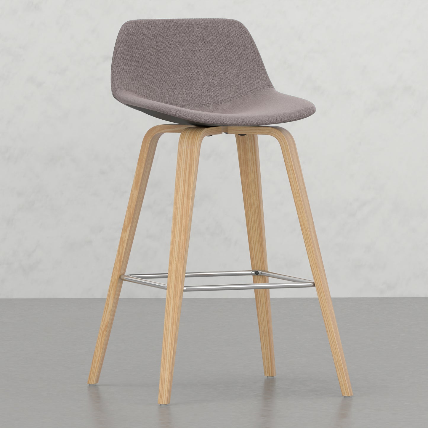 Modern grey fabric bar stool with natural wood legs and chrome footrest