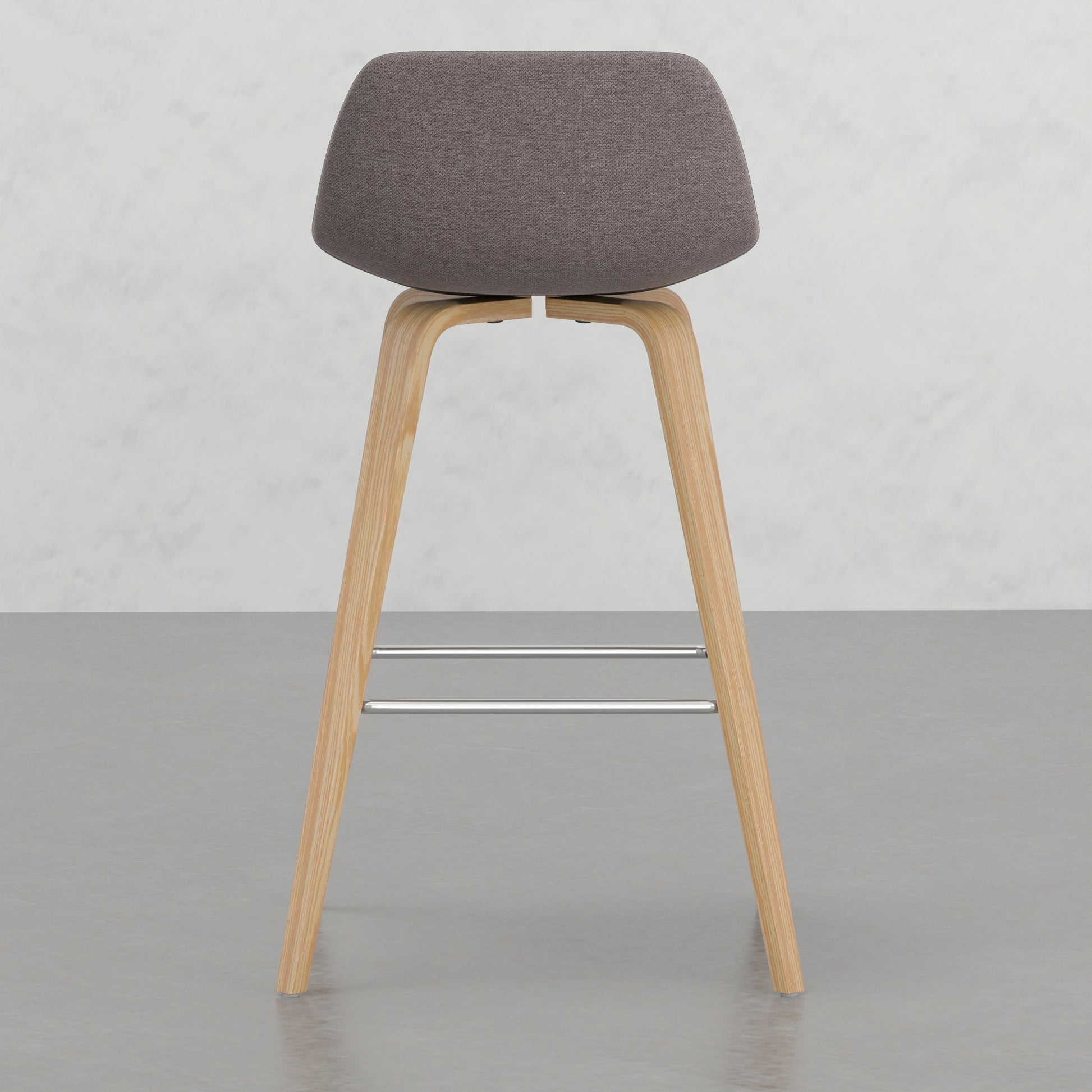 Modern grey fabric bar stool with natural wood legs and chrome footrests