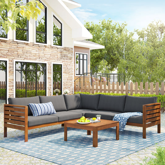 Dark gray sectional patio sofa with wooden frame and blue striped pillow