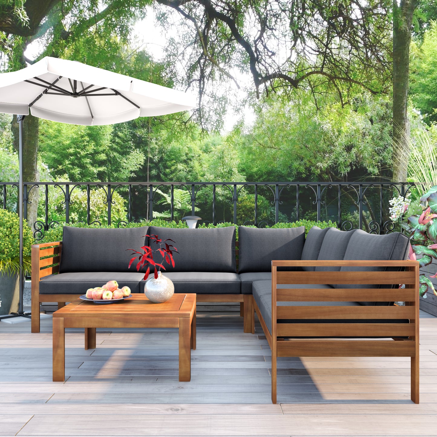 Modern sectional outdoor sofa with dark gray cushions and wood frame
