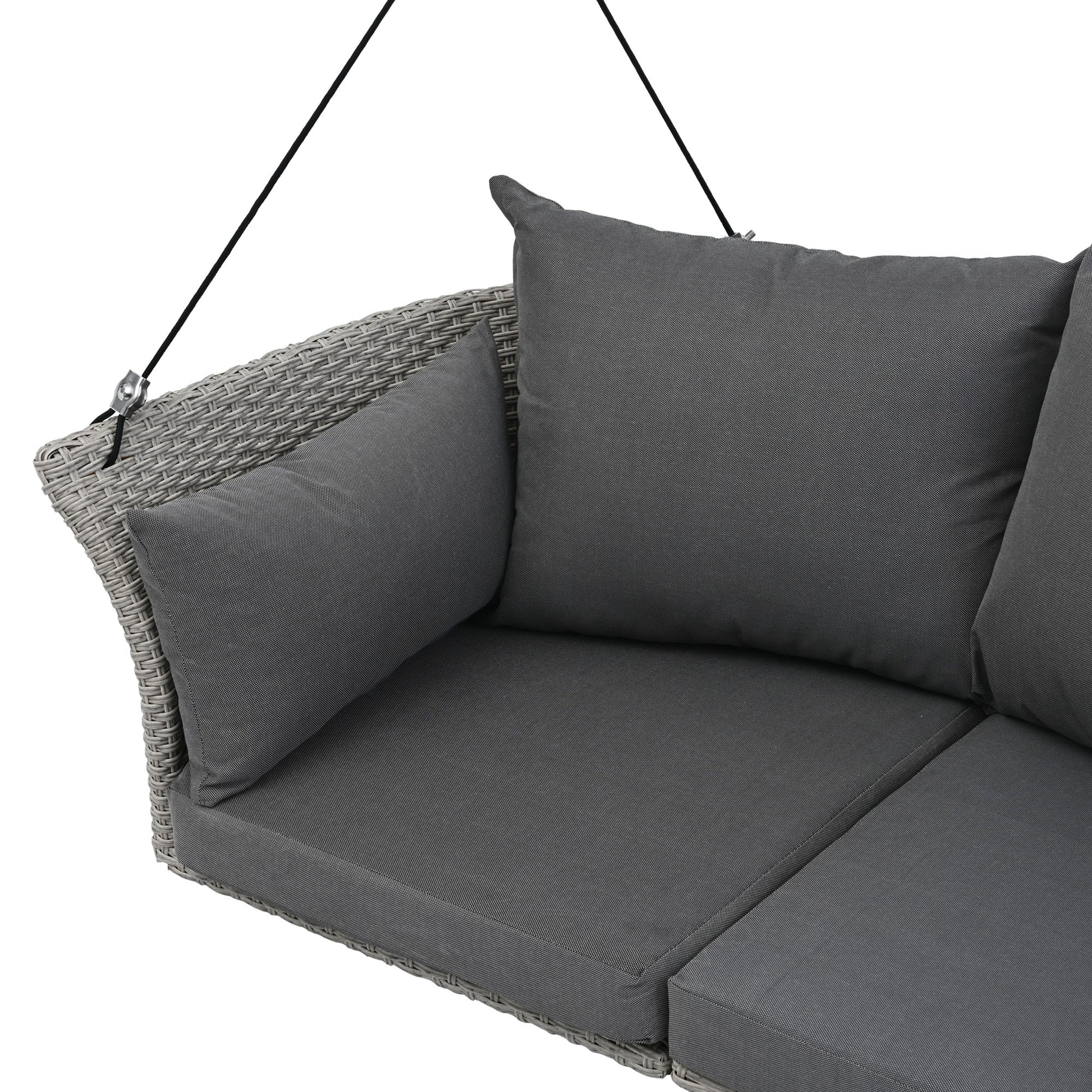 Gray wicker hanging chair with dark gray cushions
