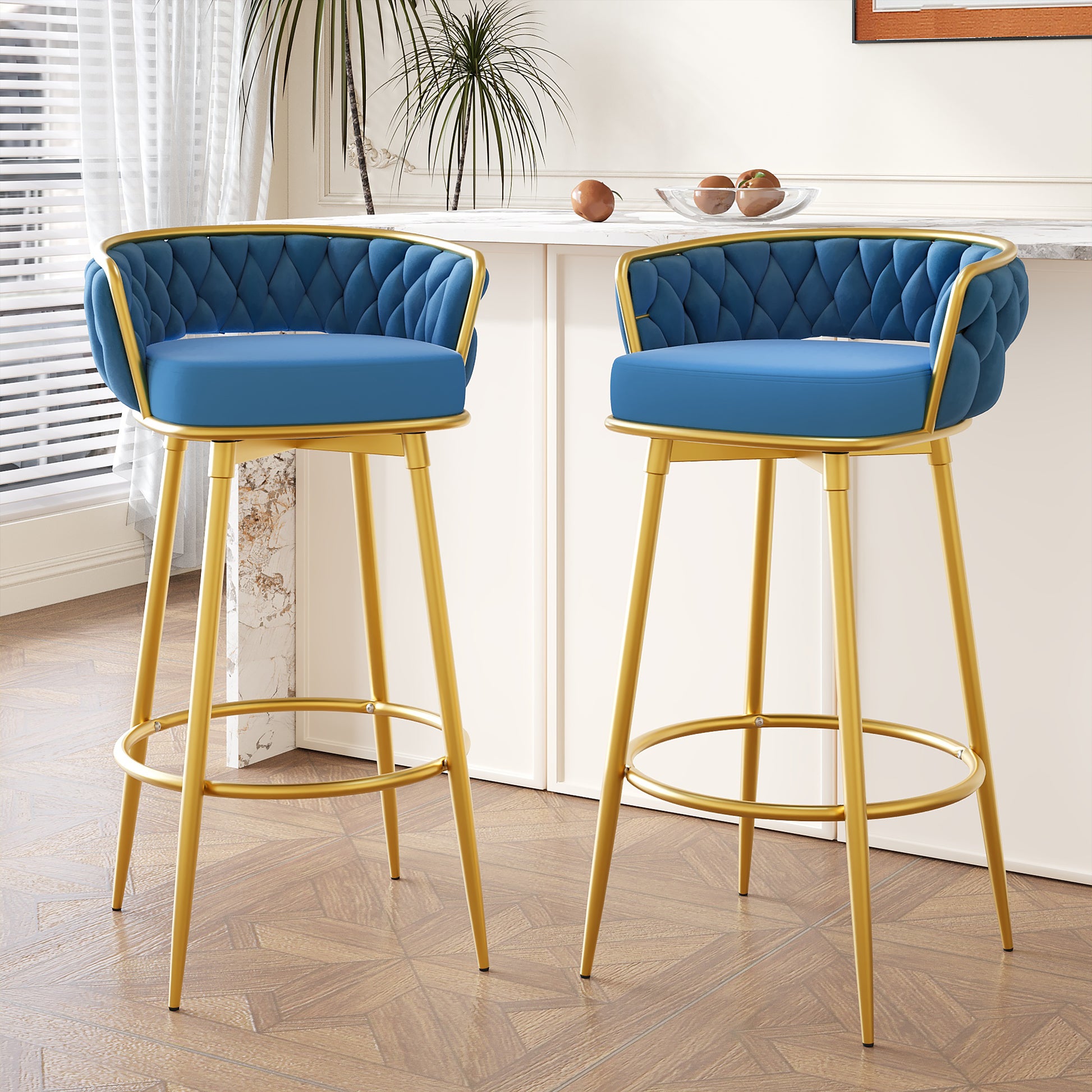 Blue velvet bar stool with tufted back and gold metal legs