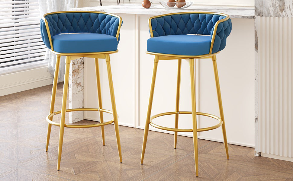 Blue velvet bar stool with gold metal legs and tufted backrest
