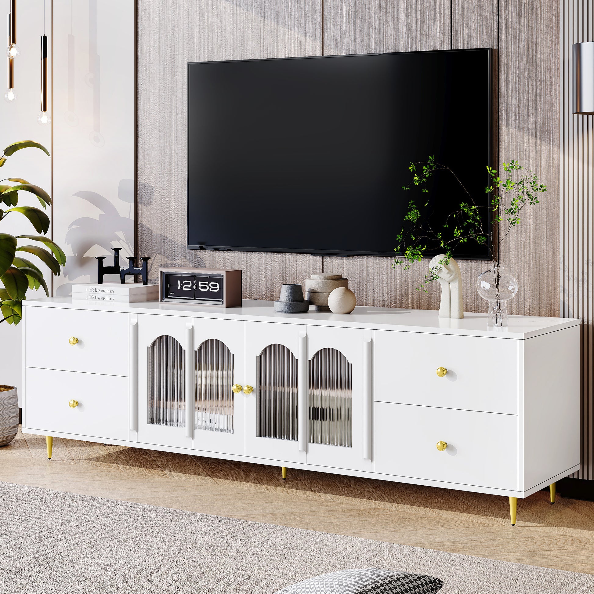 Modern white media console with fluted glass doors and gold hardware