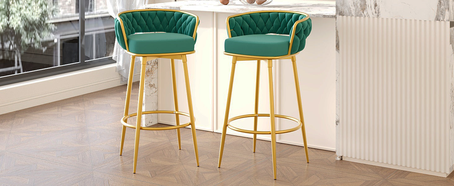 Emerald green velvet bar stool with tufted back and gold legs