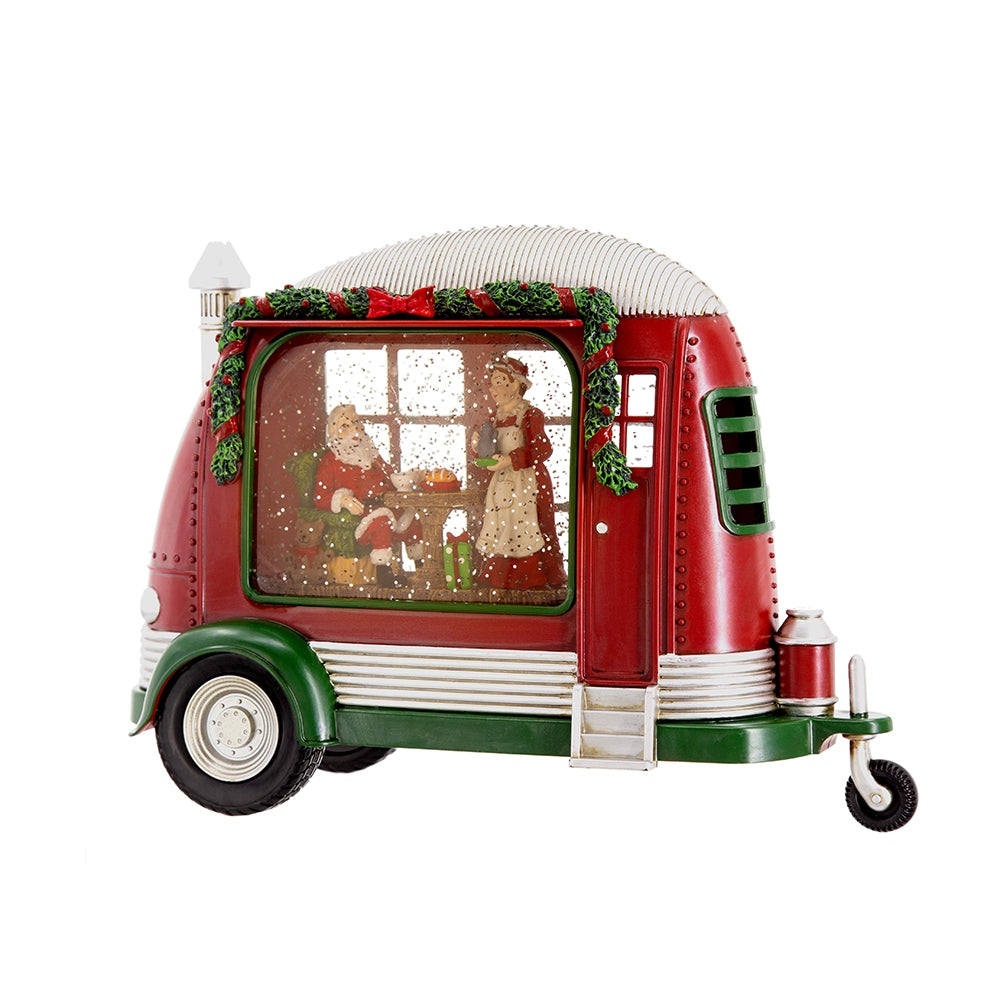 Red Christmas camper snow globe with Santa and Mrs Claus inside