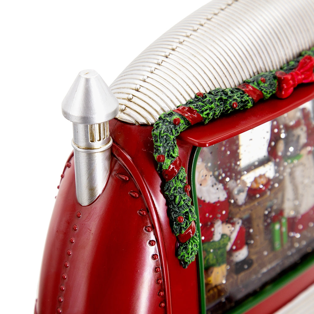 Red train snow globe with Santa inside