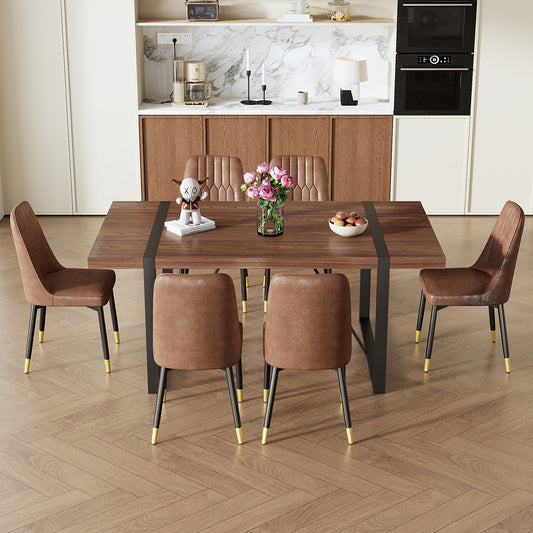 Walnut finish dining table with black metal legs and faux leather chairs